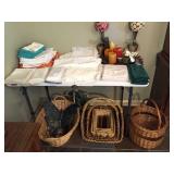 table lace, linens, brass platter, baskets, decor