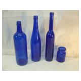 Four Blue Bottles