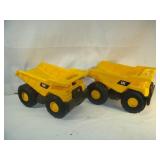 Two CAT Dump Trucks