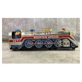 Vintage battery op. tin toy train and conductor