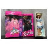 3. Barbie dolls in original boxes.