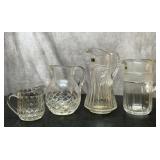 4 vintage Crystal pitchers 6'' to 11''