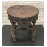Antique ornately carved small table