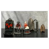 Cast-iron Amish bookends, sad irons and a match