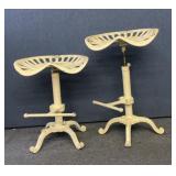 2 tractor seat bar stools cast iron