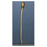 Carved face walking stick