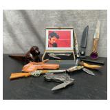 Pocket knives, dog doorstop, keychain, Wyoming