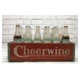 Vintage soda bottles in a cheerwine crate