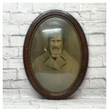 Antique framed portrait with convex glass
