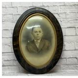 Antique framed portrait with convex glass