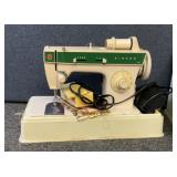 Singer 248 sewing machine with attachments