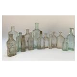 Assorted antique Medicine bottles 8''
