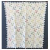 Pretty pinwheel baby quilt