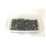 BOX OF POLISHED BLACK ROCKS