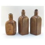 3 LEATHER COVERED LIQUOR BOTTLES