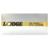 LODGE METAL SIGN 100 YEARS, STILL COOKING