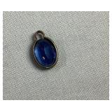 Small blue stone in 10 K gold bezel Small blue stone in 10 K gold bezel