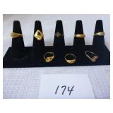 8 Costume Rings (black holder not included)