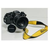 Olympus OM10. 35mm SLR. Black. Strap, uv filter,