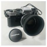 Olympus OM10. 35mm SLR. Black and chrome Olympus OM10. 35mm SLR. Black and chrome