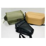 Nikon hard and soft camera cases. Black bag is Nikon hard and soft camera cases. Black bag is