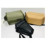 Nikon hard and soft camera cases. Black bag is