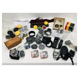 Various camera items. Filters, lens covers, light Various camera items. Filters, lens covers, light