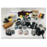 Various camera items. Filters, lens covers, light