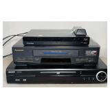 2 DVD players, 1 VHS Player, no remote for the