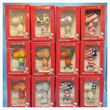 12 Porcelain Snoopy Figures, 11 out of 12 are