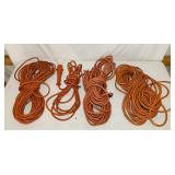 4 Long Extension Cords, one has a light 4 Long Extension Cords, one has a light