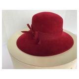 Red felt hat (Herman Marcus)