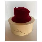 Red felt hat (Herman Marcus)