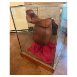 Glass display box with pole saddle