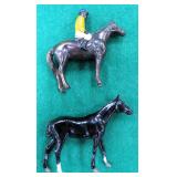 Black Jockey on Horseback and Single Horse