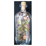 6 LBS of One Cents in Bumbu Rum Bottle