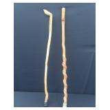 Two natural wood walking canes