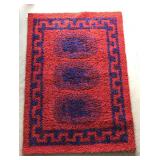 Red and blue area rug