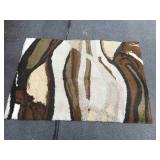 Brown and tan shag rug