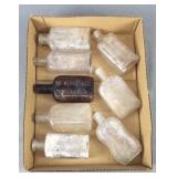 8 Assorted Vintage Whiskey Bottles - Embossed