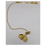 GOLD TONE CLAM PENDANT ON CHAIN - OPENS WITH