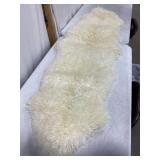 USED GENUINE SHEEP SKIN RUG, 69 X 24 IN.