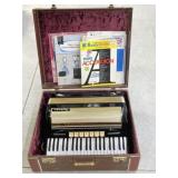 Hohner Accordion with Books in Hard Case