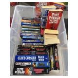 Storage Container With 31 Clive Cussler Books -