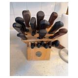 Misc brand knives in KitchenAid block, two paper towel holders