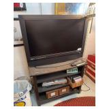 37" Olevia television with remote, TV stand, DVD/VHS player, CD