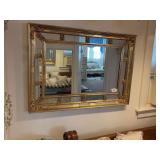 Gold framed wall mirror