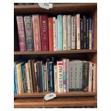 Bottom 2 shelves of books