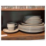 Stoneware dishes, 3-6.5” plates, 4-7.5” plates, 2-9.5” plates, 5-11.5” plates, 1 cup and saucer