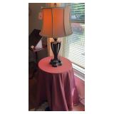 Plastic and cardboard lamp table with lamp